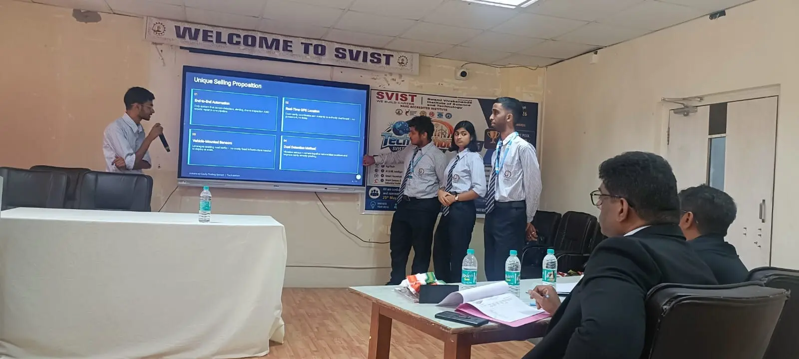 A student team presenting their project's unique selling proposition on screen to a panel of judges during TechZeathon 2026, SVIST's mega hackathon