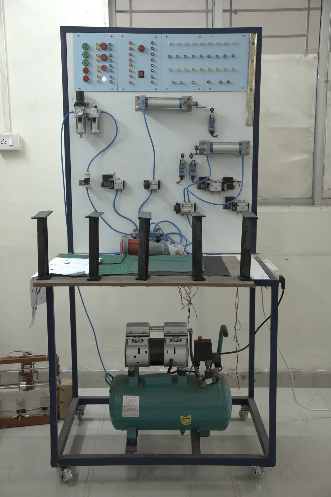 Pneumatic control trainer with compressor, cylinders and control valves in SVIST's Automation & Robotics Laboratory